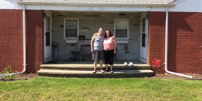 Westbay Housing clients in front of their home